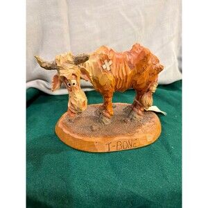 This item is a Chris Hammack 1989 Cowboy Carvin's Resin Steer Sculpture